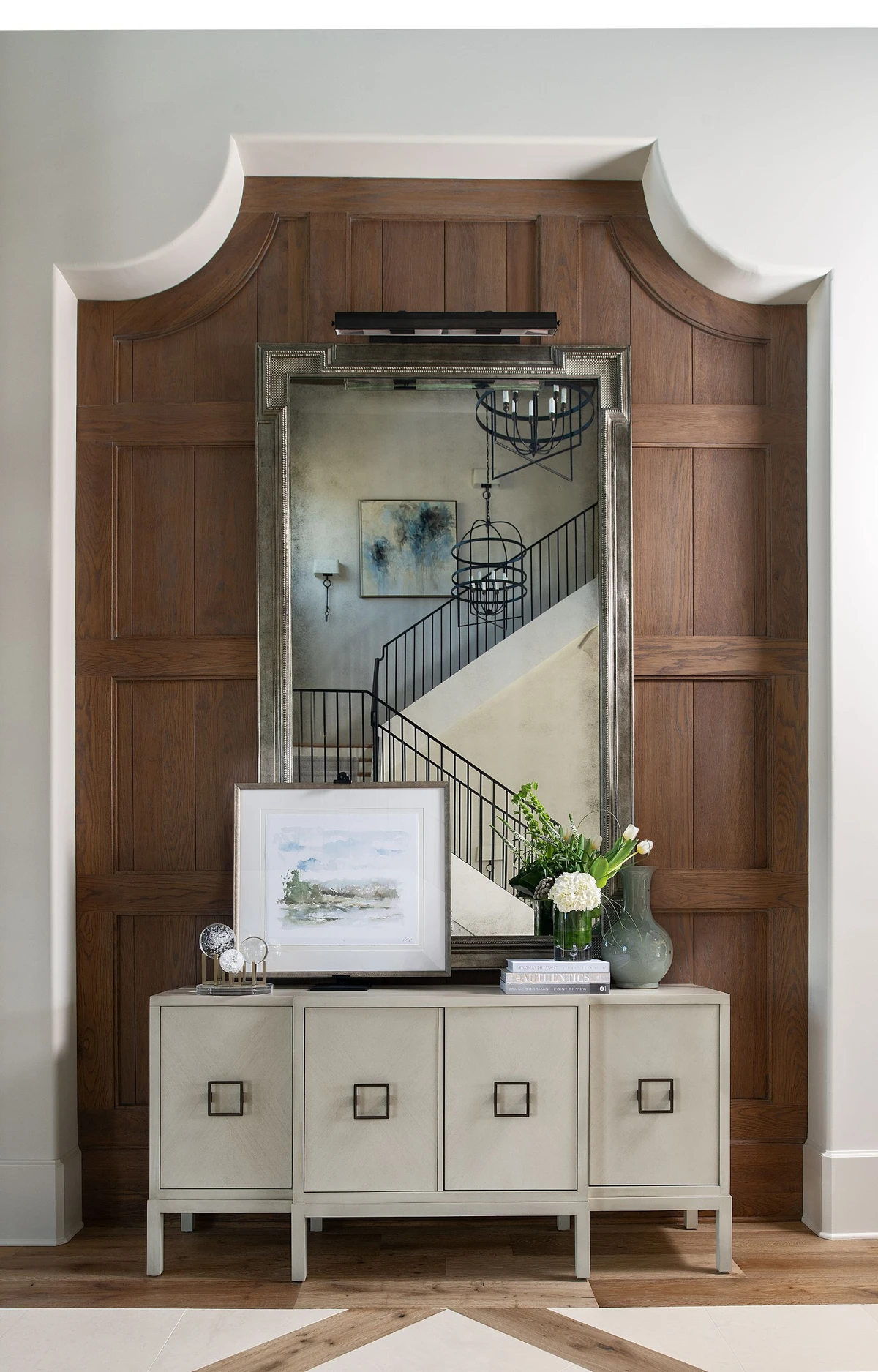 Coastal Club — entry foyer with walnut arched panel wall