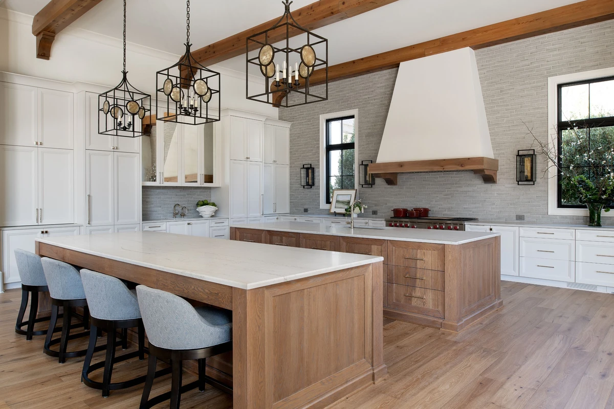 Coastal Club — open-plan kitchen with oak island and white quartz