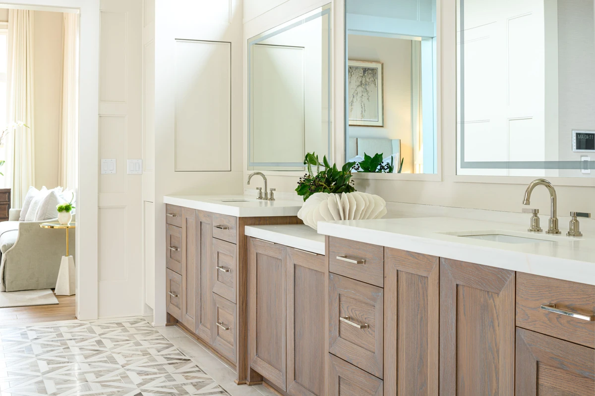 Coastal Club — primary bath with double oak vanity and diamond floor tile