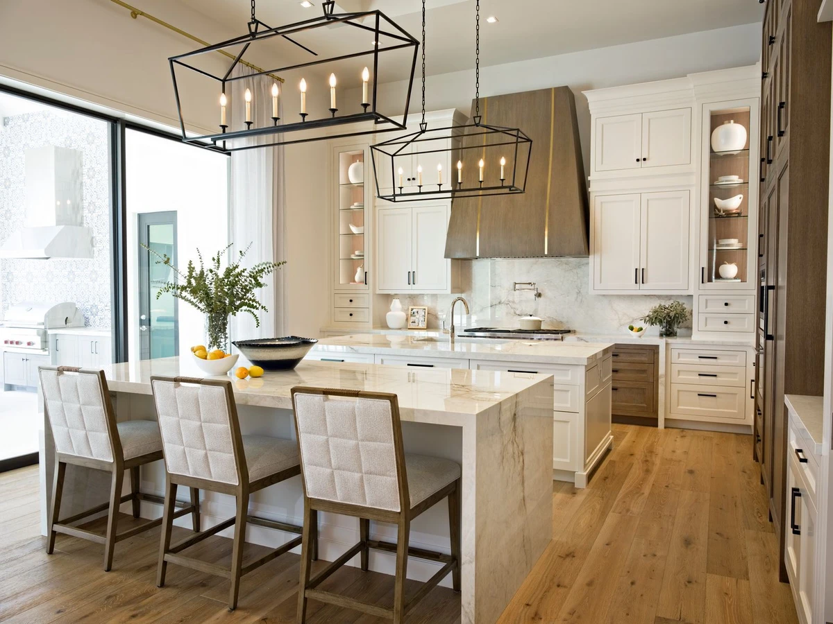Jupiter Farms — kitchen with white cabinetry and black lantern chandeliers