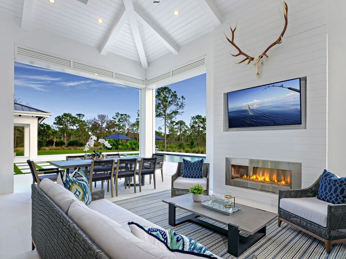 Jupiter Farms — covered lanai with fireplace and outdoor living