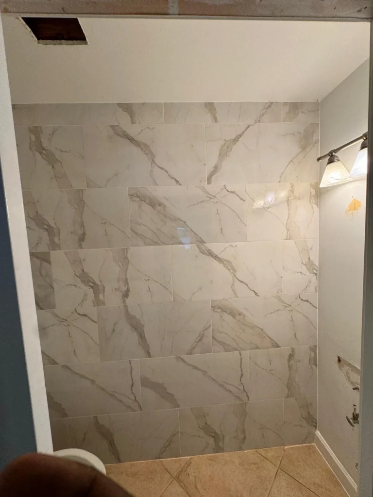 Kitchen flooring contractors in South Florida — Nakamura Contractors coordinates flooring design with cabinetry and open-concept living spaces