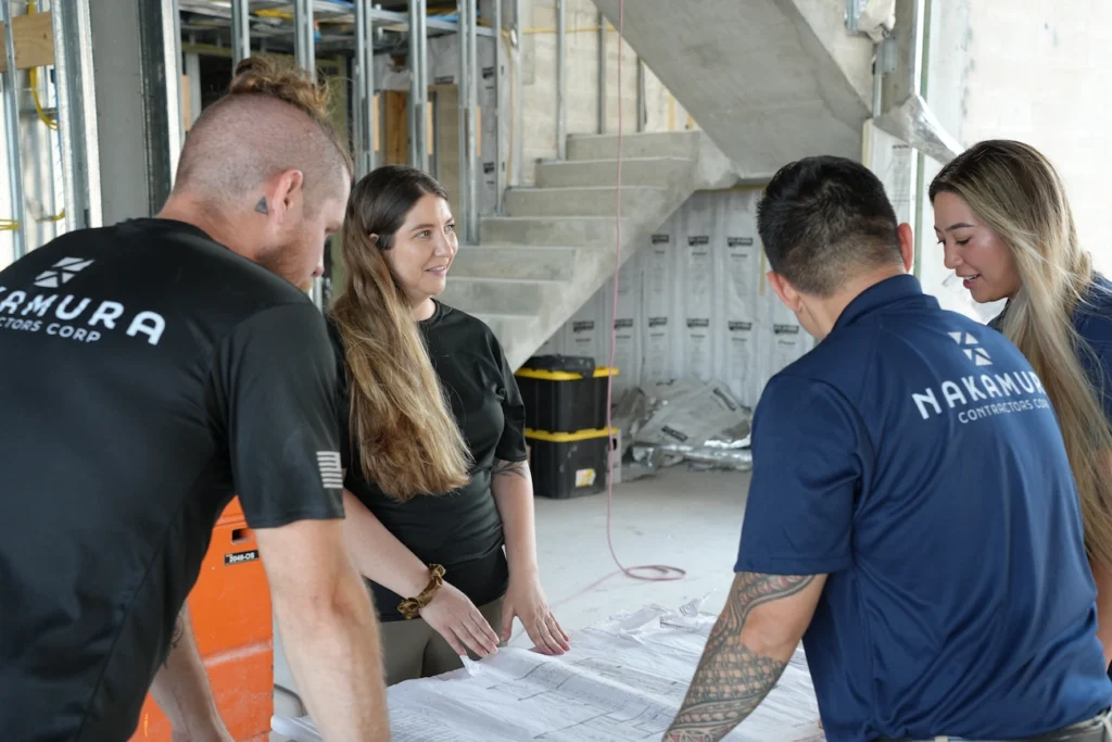 Top commercial general contractors on the Treasure Coast — the Nakamura Contractors in-house team coordinating trades on a commercial job site