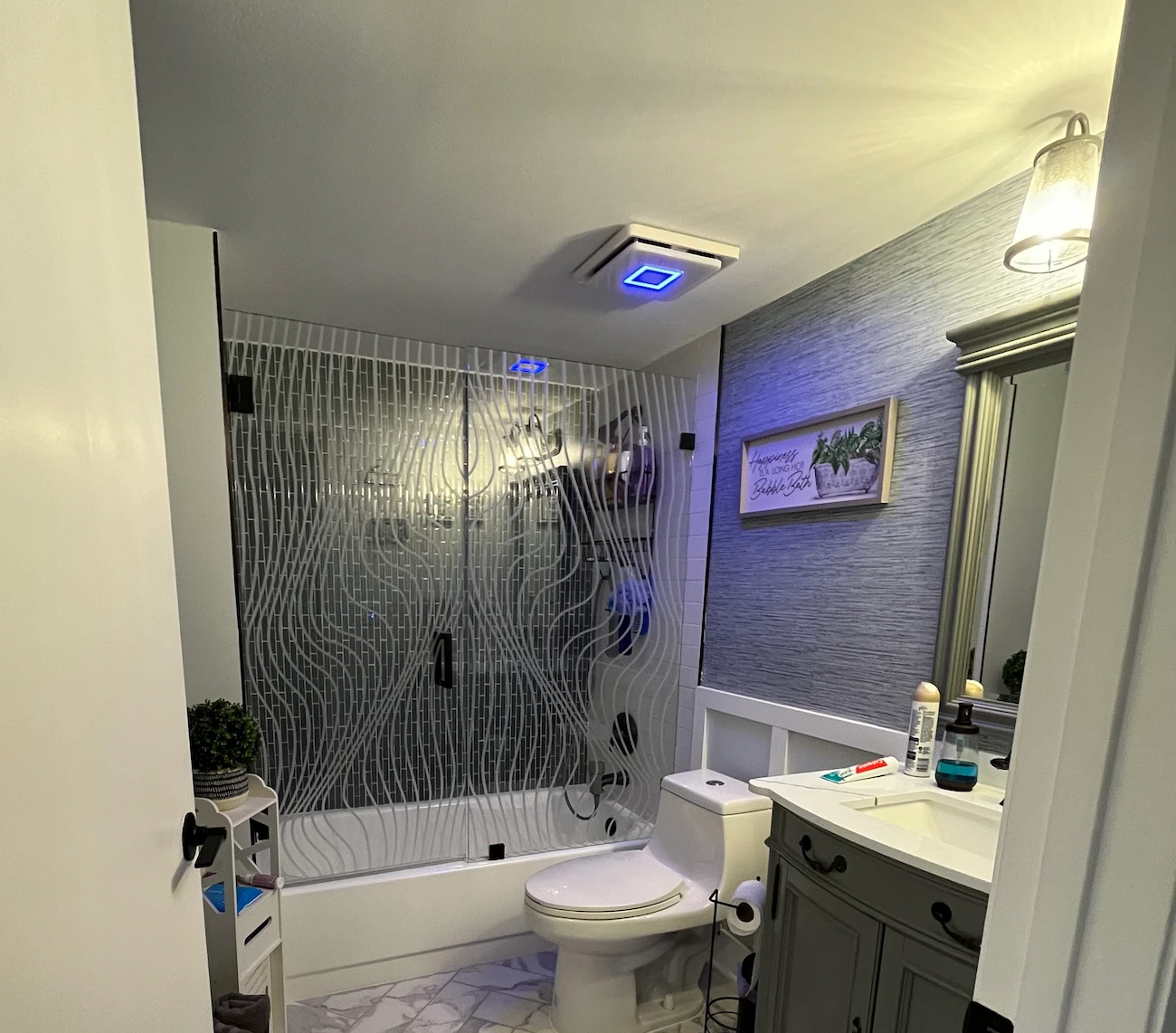 Bathroom remodel cost in South Florida — a Nakamura Contractors bathroom with a frameless glass shower, tilework and quartz vanity countertop